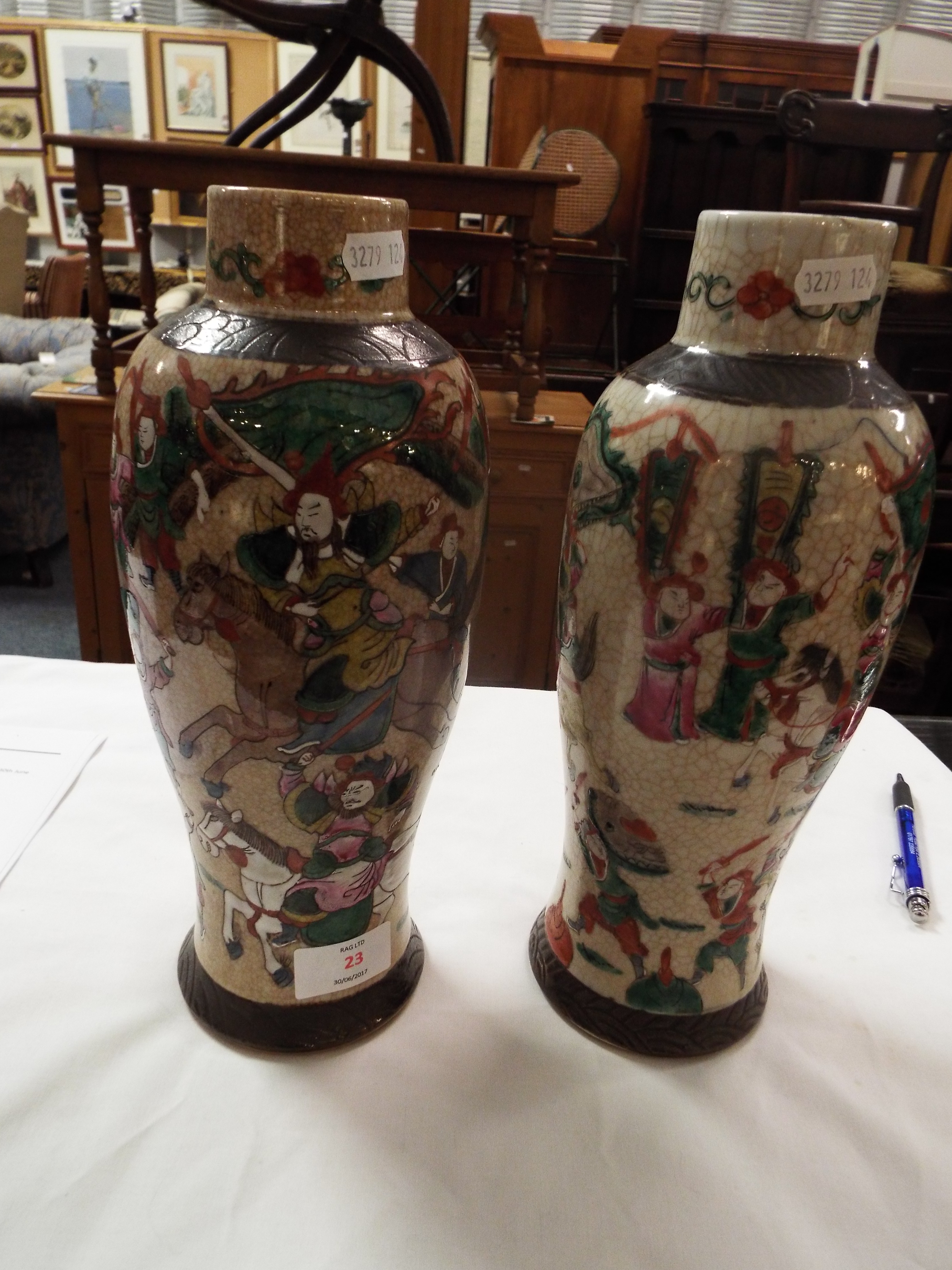 A pair of early 20thC crackle glazed Japanese vases of baluster form enamelled with battling - Image 2 of 7