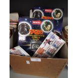 Two albums of Walkers Star Wars Trilogy Tazos, unopened 1998 England football squad medals,