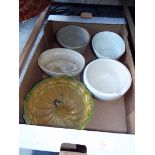 Four vintage blancmange or pate moulds and a pestle