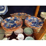 A set of eight Victorian dinner plates with four toed dragon decoration,