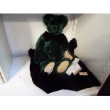 A Deans Rag Book Company limited edition luxury bear range teddy in green mohair with black bow tie