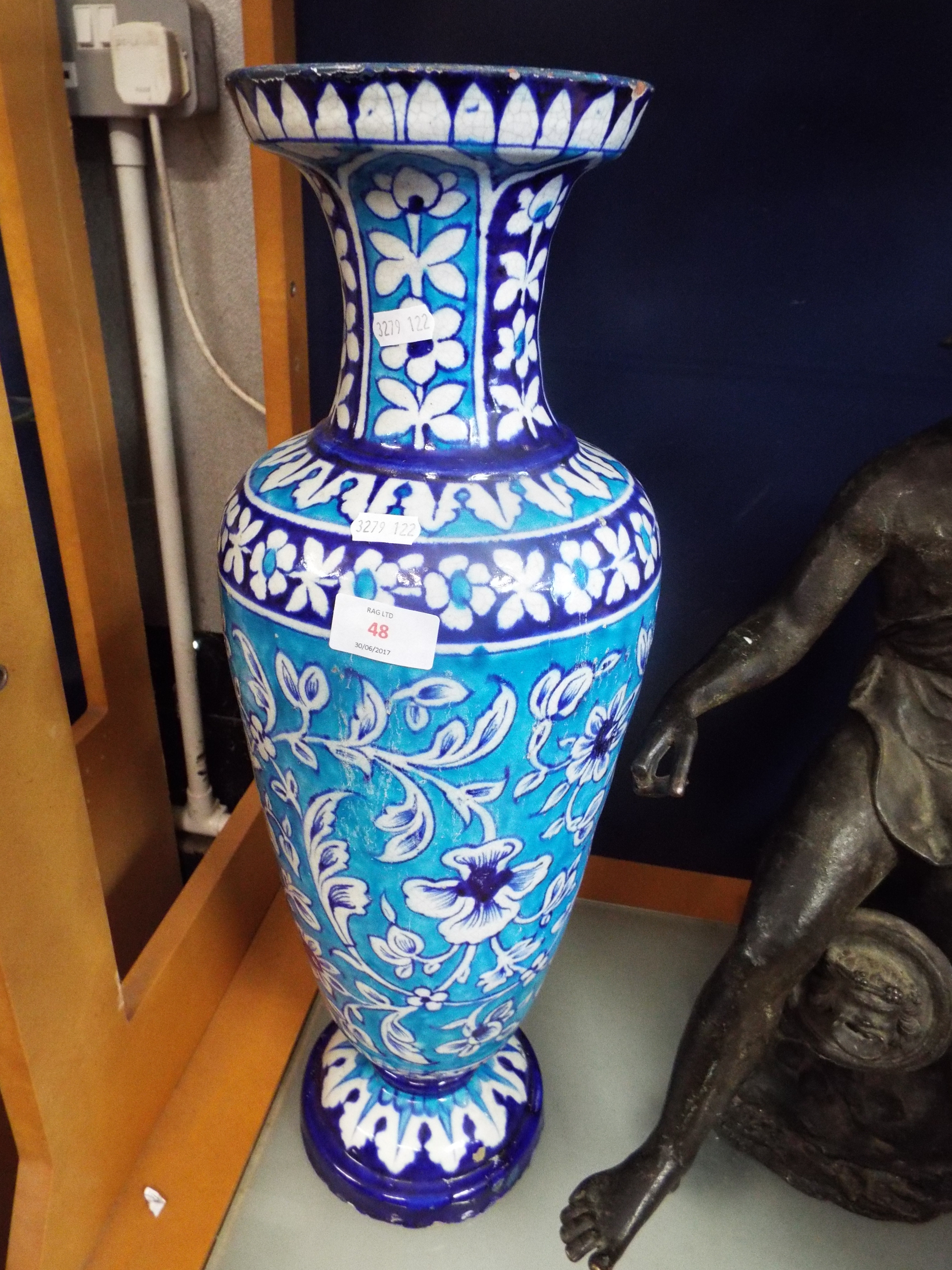 An early 20thC turquoise and blue trim glazed vase of baluster form decorated with bands and panels