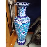 An early 20thC turquoise and blue trim glazed vase of baluster form decorated with bands and panels