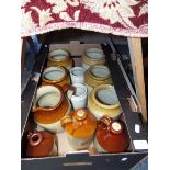 A quantity of stoneware storage jars,