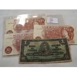 Three Bank of England ten shilling notes together with a Canadian one dollar note