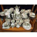 A quantity of Mason's 'Fruit Basket' patterned green dinner-ware to include cups, saucers,