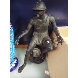 A 19thC patinated bronze figure of a Greek deity seated on a stylised rocky water fountain with