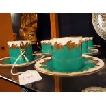 A set of six Aynsley for Thomas Goode & Co Ltd coffee cans and saucers having turquoise ground and