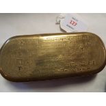 A late 18thC brass tobacco box with rounded ends having embossed almanac and calendar design,