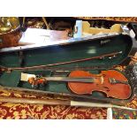 A mid-20thC student violin and bow housed in a wooden case (case A/F)