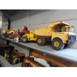 Four vintage 1960's Tonka toys to include two tipper trucks and two loaders