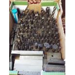 A box of assorted milling cutters and parallels