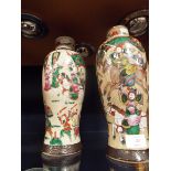 A pair of early 20thC crackle glazed Japanese vases of baluster form enamelled with battling
