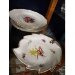 Two Meissen basket weave plates and bowl each hand-painted with central floral sprays and gilt