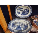 Two antique blue and white meat platers with pagoda scene