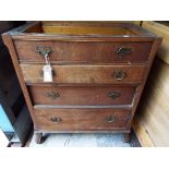 A late Victorian secretaire chest of four graduated drawers flanked by fluted pilasters and raised