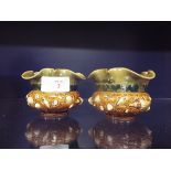 A pair of unusual Royal Doulton Art Nouveau flared rim pots moulded in relief with sea shells