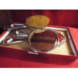 A silver backed brush and hand held mirror together with an Art Nouveau silver backed mirror having