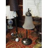 A Victorian brass rise and fall table lamp with frosted glass shade together with a column shaped