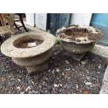 A pair of reconstituted stone garden pedestal garden urns