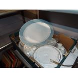 A selection of Poole dinnerware together with a large blue and white platter