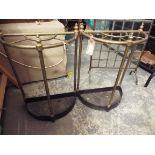 A pair of brass Victorian style demi lune umbrella/stick stands