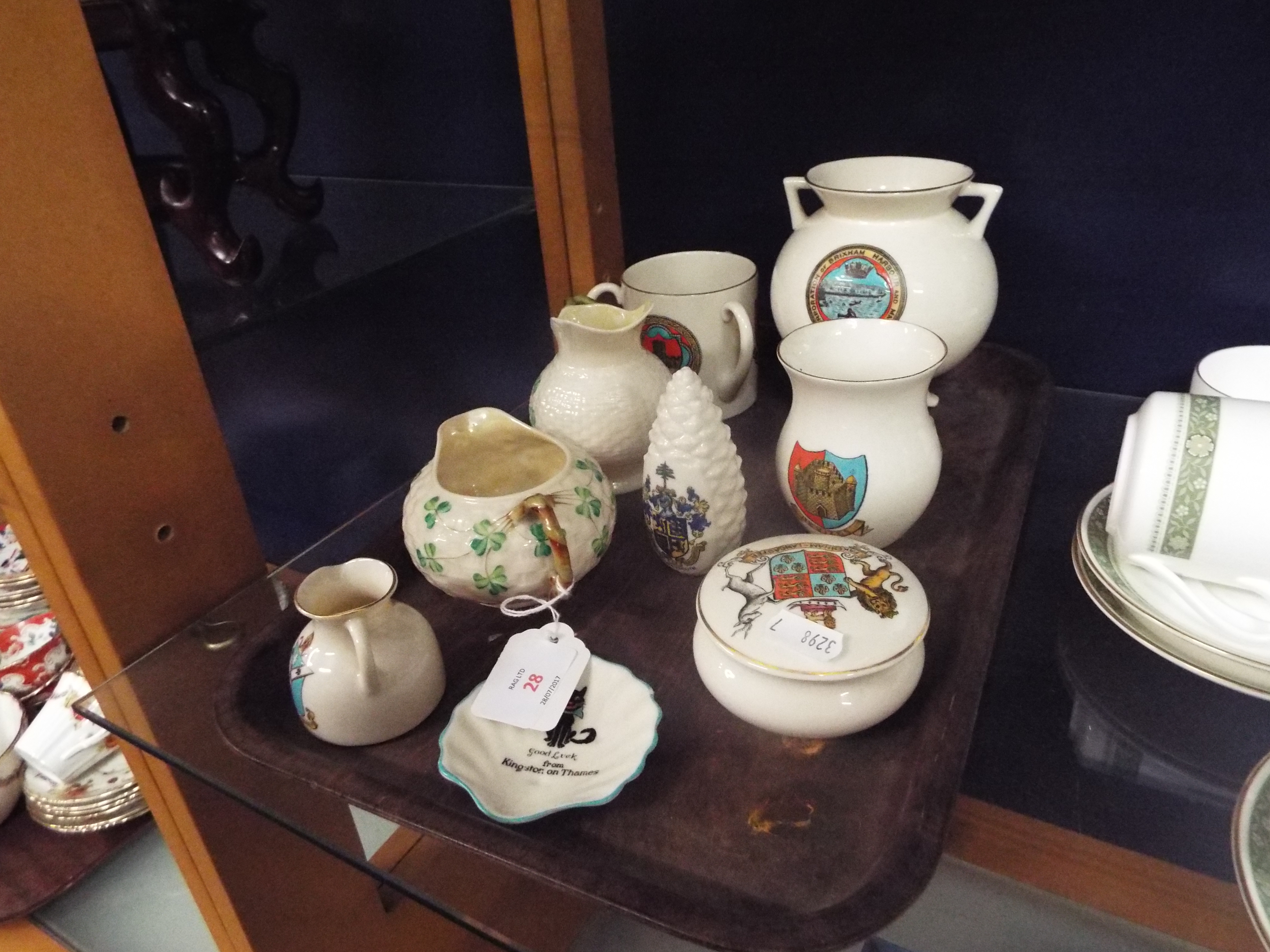 Two Belleek basket weave jugs decorated with shamrocks with black and green marks to bases,