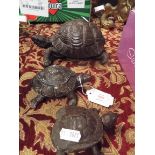 Two spelter tortoises, one in the form of an ashtray and the other a stamp box,