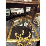 A George III arched top girandole wall mirror set in a gilt acanthus and rope twist gesso frame