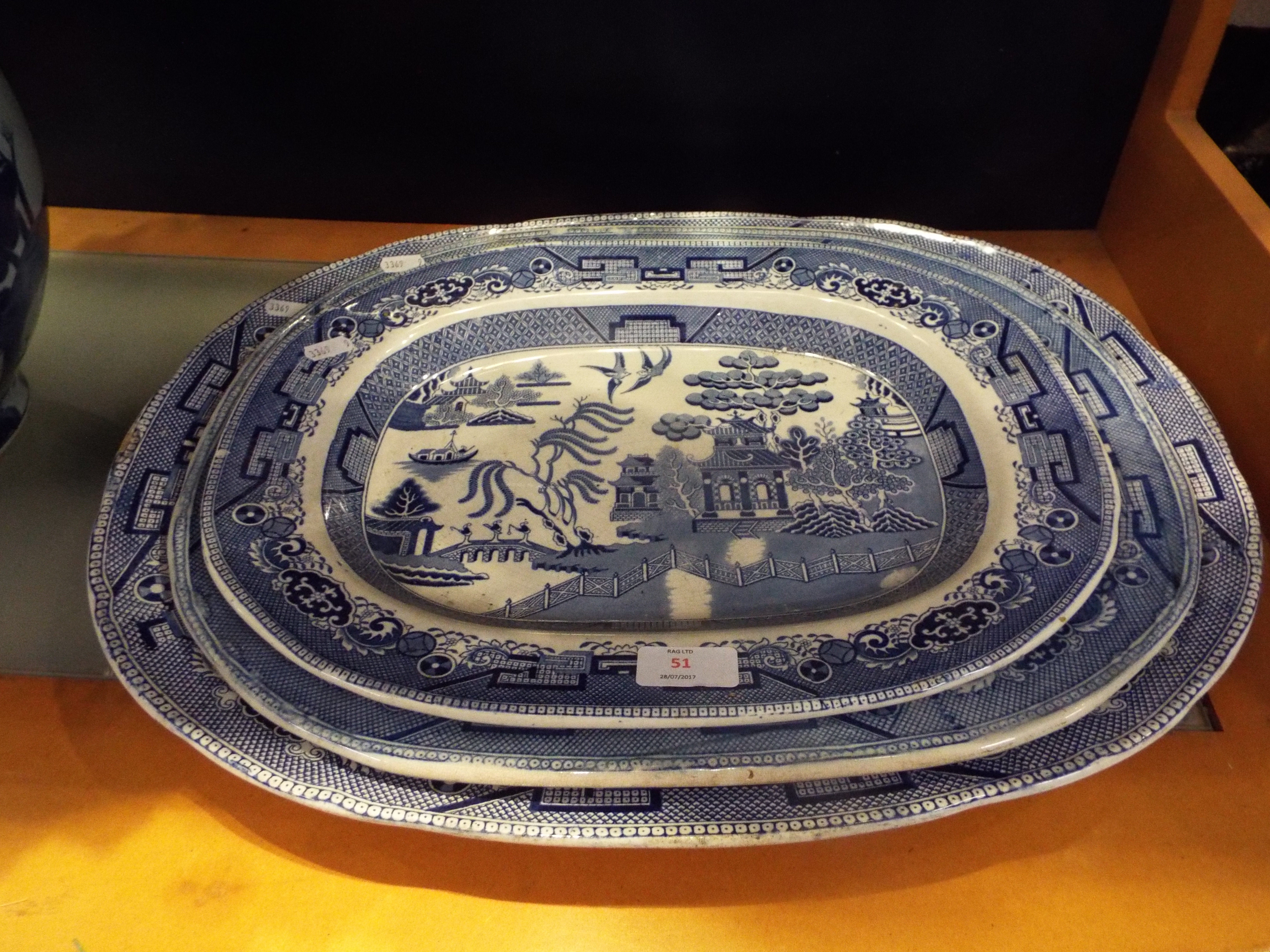 A large Davenport 'Willow Pattern' meat plate together with two smaller