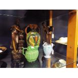 A Barnstaple mottled blue tri-handled vase, a 19thC green glazed Greek key and diamond moulded jug,
