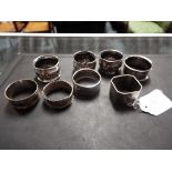 Eight silver and plate napkin rings