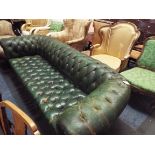 A green leather button back three seater Chesterfield sofa