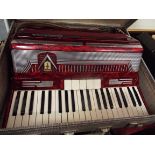 A mid-20thC Frontalini red marble effect accordion