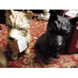 Two mid-20thC black and white spelter figures of Scottish Terriers