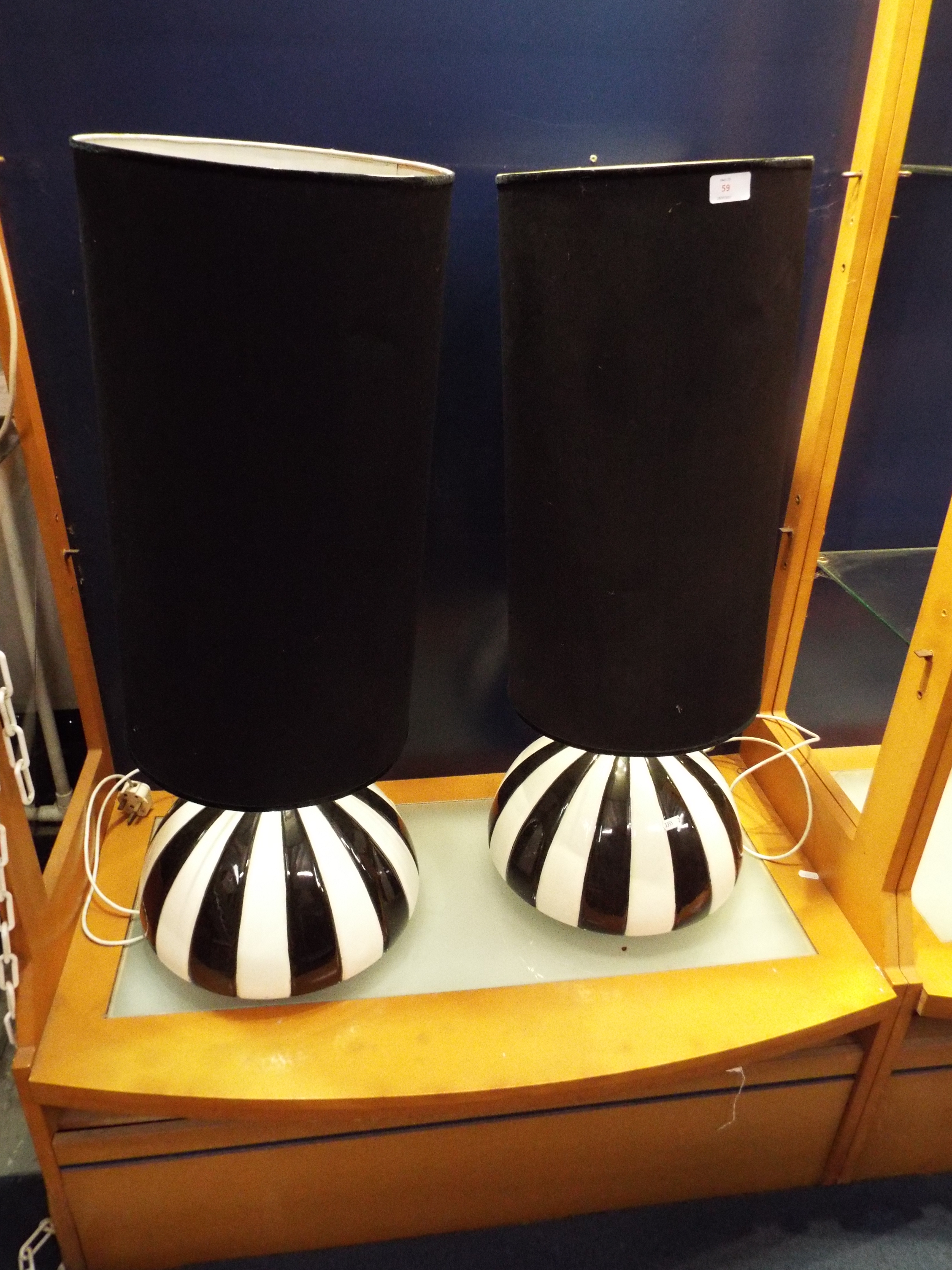 A pair of Italian black and white segmented ceramic table lamps and shades