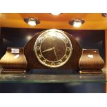 A walnut cased mantel clock