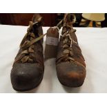 A pair of early children's leather football boots