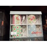 A boxed set of four as new Cath Kidston mugs in various patterns
