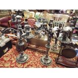 A pair of very ornate silver plated four branch candelabra with acanthus leaf sconces and fan leaf