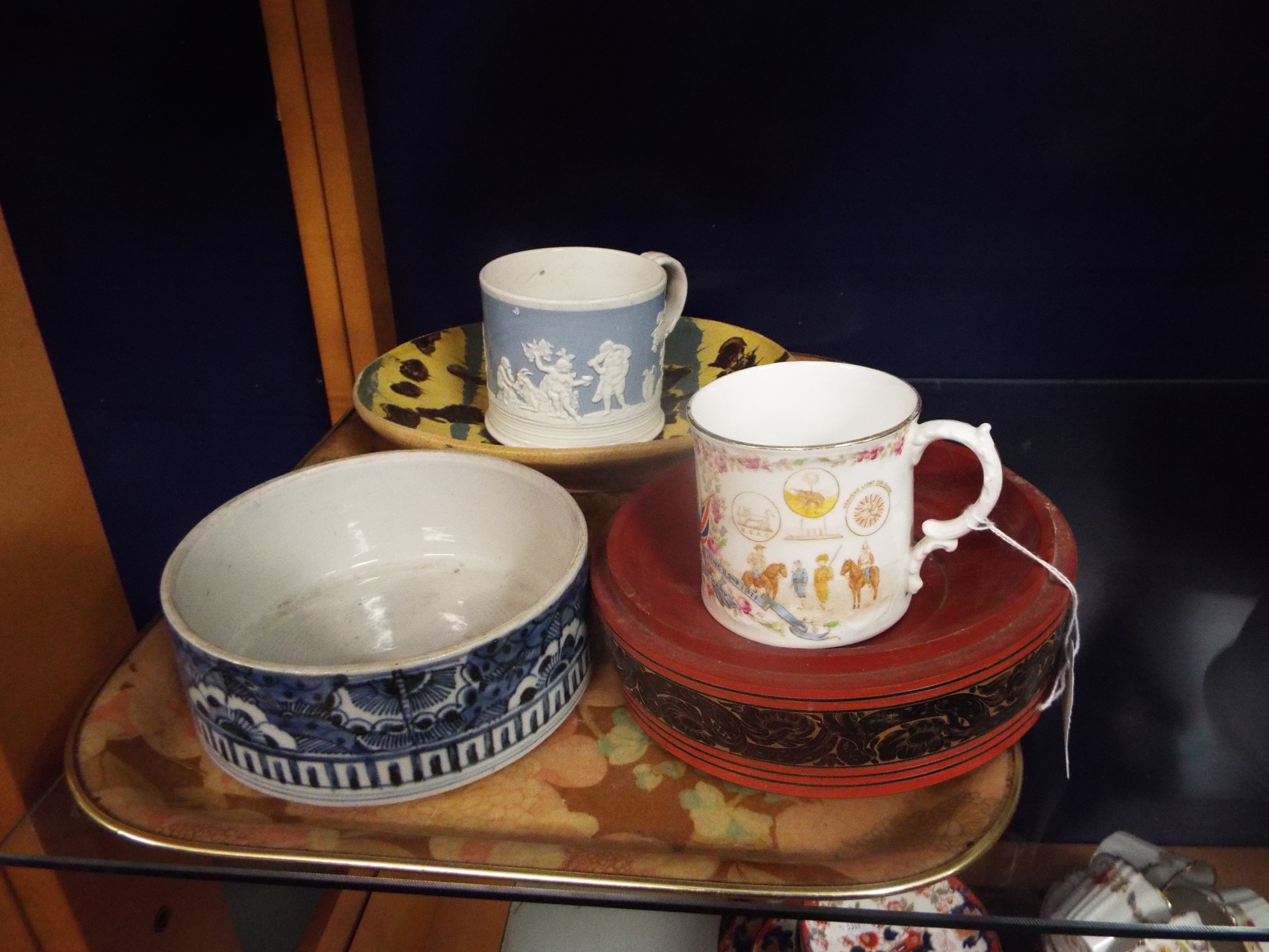 An Aynsley 1911 coronation mug and Italian slipware bowl, a red lacquered bowl,