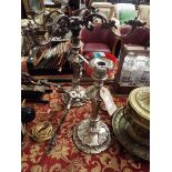 A pair of very ornate silver plated four branch candelabra with acanthus leaf sconces and fan leaf