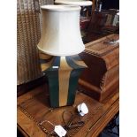 A modern green and gilt painted tole work lamp in the form of a lantern,