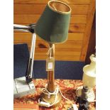 A brass bugle converted to a table lamp