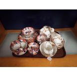 An early Royal Albert floral decorated part tea set together with an English porcelain tea set in