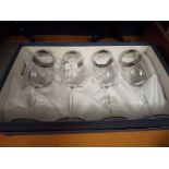 A boxed set of four Italian wine glasses,