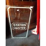 A glass window panel inscribed 'Station Master'