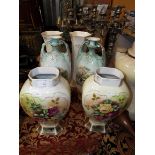 Three pairs of Victorian transfer printed vases decorated with flowers and country scenes