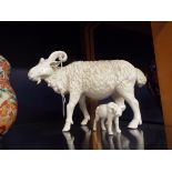 An early 20thC blanc de chine goat (possibly Chinese) together with a blanc de chine water buffalo