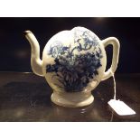 A Chinese blue and white Cadogan rice wine pot of peach form decorated with birds amongst blossoms,